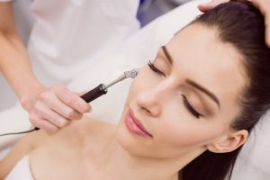 dermatologist-performing-laser-hair-removal-patient_107420-65627