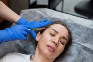 high-angle-woman-getting-prp-injection_23-2149341415